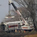 Cranes on Monday removed the last car from a train derailment in the Bronx that killed four passengers the day before.