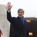 Secretary of State John Kerry waves as he boarded a plane at Brussels National Airport Wednesday.