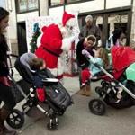 Globe Santa greeted youngsters outside the Rattlesnake Bar, where a Globe Santa event was held Wednesday.