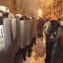 Supporters of EU integration lined up in front of riot police with shields during a rally in Kiev.