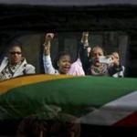 Hundreds of people joined hands while going up a hill to view the body of Nelson Mandela in Pretoria on Wednesday. Mourners waited for hours in lines that snaked through the city for miles to catch a final glimpse of the antiapartheid leader and first black president of South Africa.