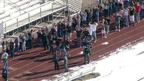 Students gather just outside of Arapahoe High School in Centennial, Colo., as police responded to reports of a shooting.
