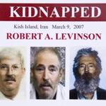 An FBI poster from 2012 shows images of retired FBI  agent Robert Levinson, including one from his abductors and one showing what he might look like now.