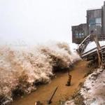 Large waves crashed over sand barriers, destroying the decks of homes along the beach on Plum Island during a storm last winter.
