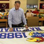 Ned Flynn, president New England Flag & Banner, inspected a University of Kansas banner.