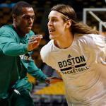Big man Kelly Olynyk (right) works out with Rajon Rondo before Monday night’s game.  