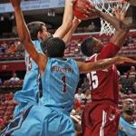 Florida State's Boris Bojanovsky chalks up one of his seven blocks by rejecting UMass’s Cady Lalanne under the basket.