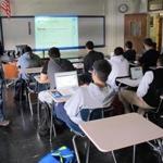 Math students follow a lesson in a digital textbook at Archbishop Stepinac High School in White Plains, N.Y.