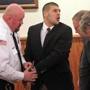 Aaron Hernandez mouthed words to family members after he appeared in court at the Fall River Justice Center on Monday.