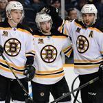 Carl Soderberg, Ryan Spooner (center), and Patrice Bergeron (right) celebrate a Soderberg goal in the third period against the Predators, his fifth tally of the season.