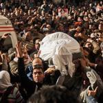 Egyptians carried the coffin of a victim killed in the explosion at a police headquarters during a funeral in the Nile Delta city of Mansoura on Tuesday. Egypt has seen an escalating campaign of spectacular bombings, drive-by shootings, assassinations, and mass killings.