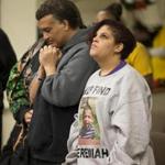 Sandrino Oliver and his sister, Luz, prayed for their nephew, missing 5-year-old Jeremiah, at a service Thursday in New Creation Community Church in Fitchburg.