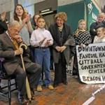Mayor Thomas Menino, his wife Angela (right), and his grandson Thomas Menino III were greeted by Boston students.