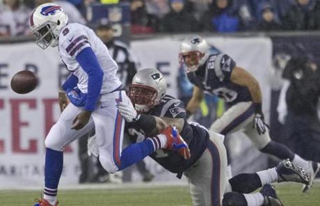 The Bills' Thad Lewis fumbled the ball while being run down by Sealver Siliga.
