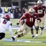 BC quarterback Chase Rettig (11) scampers for a short gain during the first half of the AdvoCare V100 Bowl.. (AP Photo/Rogelio V. Solis)