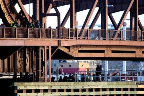 Police, fire, and other personel were at the scene on the Meridian Street bridge after a woman was killed.
