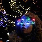 Isabel Lord, 16, of Boston, took in a skating performance at the colorfully lit Frog Pond during the city’s 38th First Night celebration. 