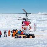 A helicopter picked up the first batch of passengers from the stranded Russian ship MV Akademik Shokalskiy on Thursday at the beginning of a rescue operation. The ship has been trapped in the ice off Antarctica for more than a week.