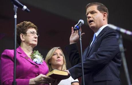 Martin Walsh was sworn in as mayor of Boston as  his mother, Mary Walsh,  and partner, Lorrie Higgins, looked on.
