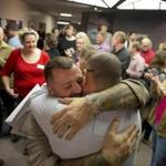 Chris Serrano (left) and Clifton Webb embraced after being married in Salt Lake City in December. 