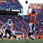 Wes Welker hauls in a 3-yard touchdown pass from quarterback Peyton Manning in the second quarter that helped the Broncos to a 14-0 lead.
