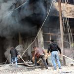 Buildings in Daraya, southwest of Damascus, burned as opposition forces fought Syrian government troops on Sunday. 