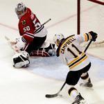 The Bruins’ Gregory Campbell is handed a wide-open net to shoot at in overtime, but can’t get his stick on the puck to beat goalie Corey Crawford and the Blackhawks.