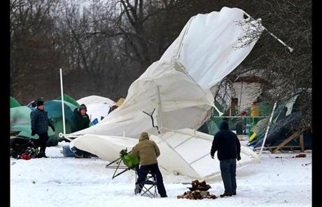 A heavy gust blew over a large tent at the gathering in Danvers’s Endicott Park.
