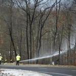 Crews extinguished flames from a tanker truck fire that closed all lanes of traffic on Route 24 in Fall River.
