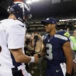  Peyton Manning (left) and Russell Wilson have met before, but this time it will be on the NFL’s biggest stage (AP Photo/John Froschauer, File)