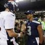  Peyton Manning (left) and Russell Wilson have met before, but this time it will be on the NFL’s biggest stage (AP Photo/John Froschauer, File)