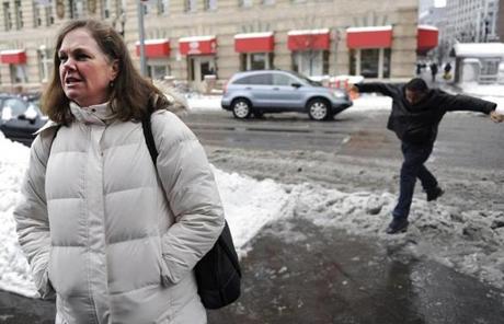 As a man jumped over a slushy puddle, Kathleen Newell of Norton described her empty office. 
