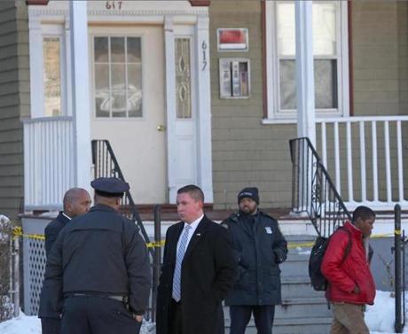 Police investigating the fatal shooting of a Mattapan boy outside the Morton Street home where he was shot.
