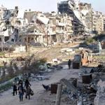 Some civilians were able to flee a besieged district of Homs as part of an evacuation by UN workers on Sunday.