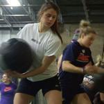 US Olympic women’s hockey player Josephine Pucci (front) works the medicine ball at Mike Boyle’s fitness center.