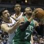 Milwaukee’s Zaza Pachulia reached in on Jared Sullinger in the first half. 