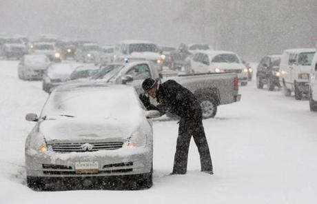 A highway patrol officer checked on the safety of a motorist in Raleigh, N.C.
