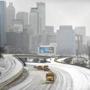 Snow plows cleared a highway in Atlanta on Wednesday.