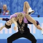 Meryl Davis is lifted by Charlie White during their gold-medal performance in Monday’s free dance. (AP Photo/Darron Cummings)