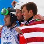 France's Pierre Vaultier, center, celebrates his gold medal with silver medalist Nikolai Olyunin of Russia, left, and bronze medalist Alex Deibold, right, of the United States.