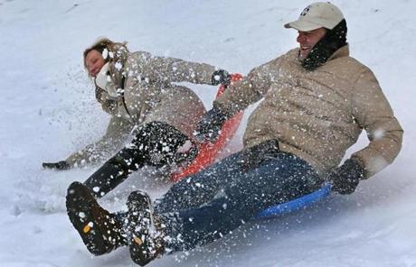  Betsy Murphy and Michael Hogan of Los Angeles went sledding in the Fenway.
