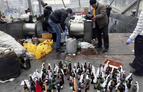 Protesters prepared Molotov cocktails during clashes with police Thursday.
