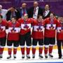 Canadian team members listened to their national anthem after receiving their gold medals.