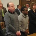 Accused asonists Mark Sargent (second left) and Jeanmarie Louis (third left) appeared in Plymouth Superior Court.