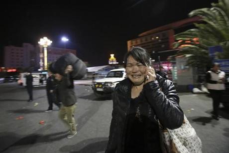 A woman reacted outside the scene of a deadly knife attack at a train station in southwestern China's Yunnan province. 
