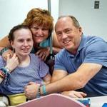 Justina Pelletier (left) with her parents, Linda and Lou Pelletier, at Boston Children's Hospital last year.