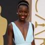 Lupita Nyong’o looked as if she was a floating goddess in a pale blue gown, custom-made from Prada. 