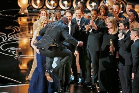 A leaping director-producer Steve McQueen celebrated with cast members after the historical drama “12 Years a Slave” was named best picture at the Academy Awards Sunday night.
