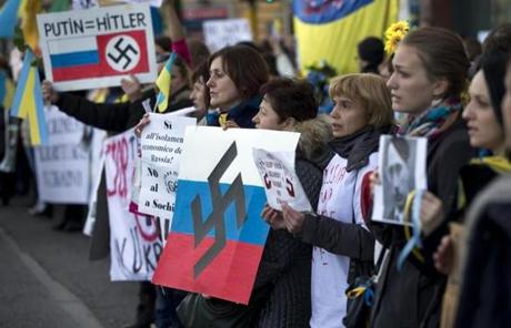 Ukrainians living in Italy protested outside the Russian embassy in Rome.
