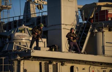 Ukrainians stood guard on the navy ship Slavutich at the harbor of Sevastopol, Ukraine.

